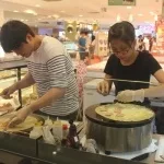 Singapore Francophile Club members preparing crepes together